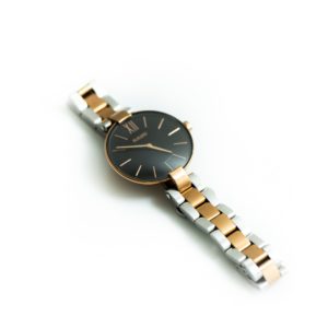 gold and silver round analog watch