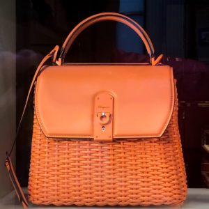 brown leather handbag on brown wooden table